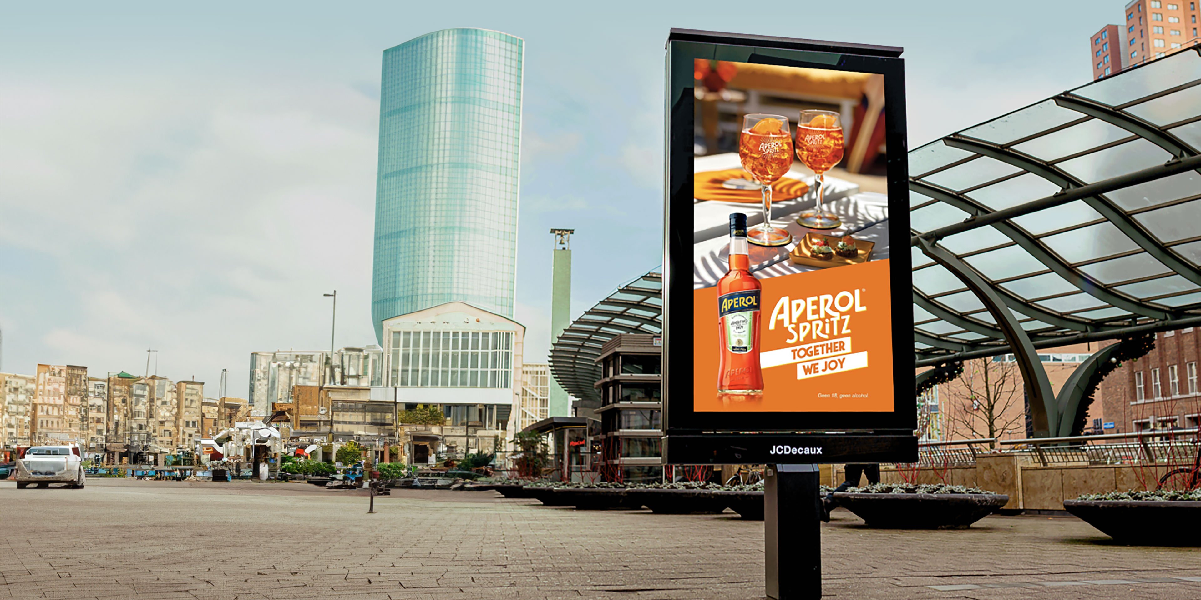 DOOH alcohol advertisement displaying and Aperol ad