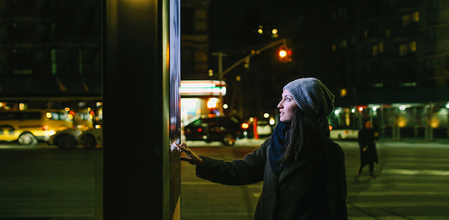 Woman using interactive screen