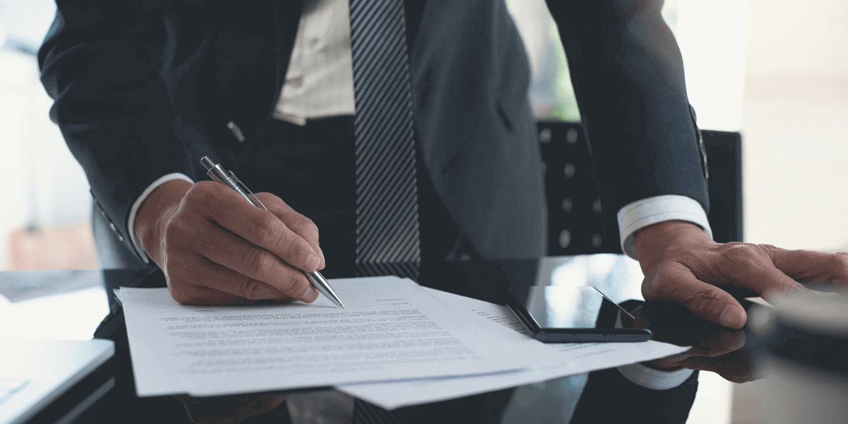 Man signing long term contract-1