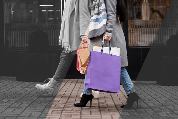 A couple holding shopping bags