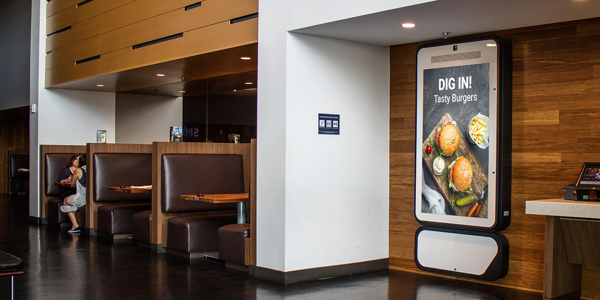 A DOOH advertisement inside a restaurant 