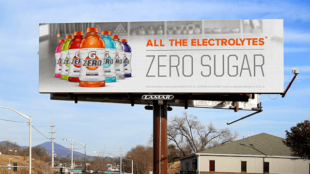 Large billboard over a house displaying Gatorade Zero in a variety of flavors and colors.